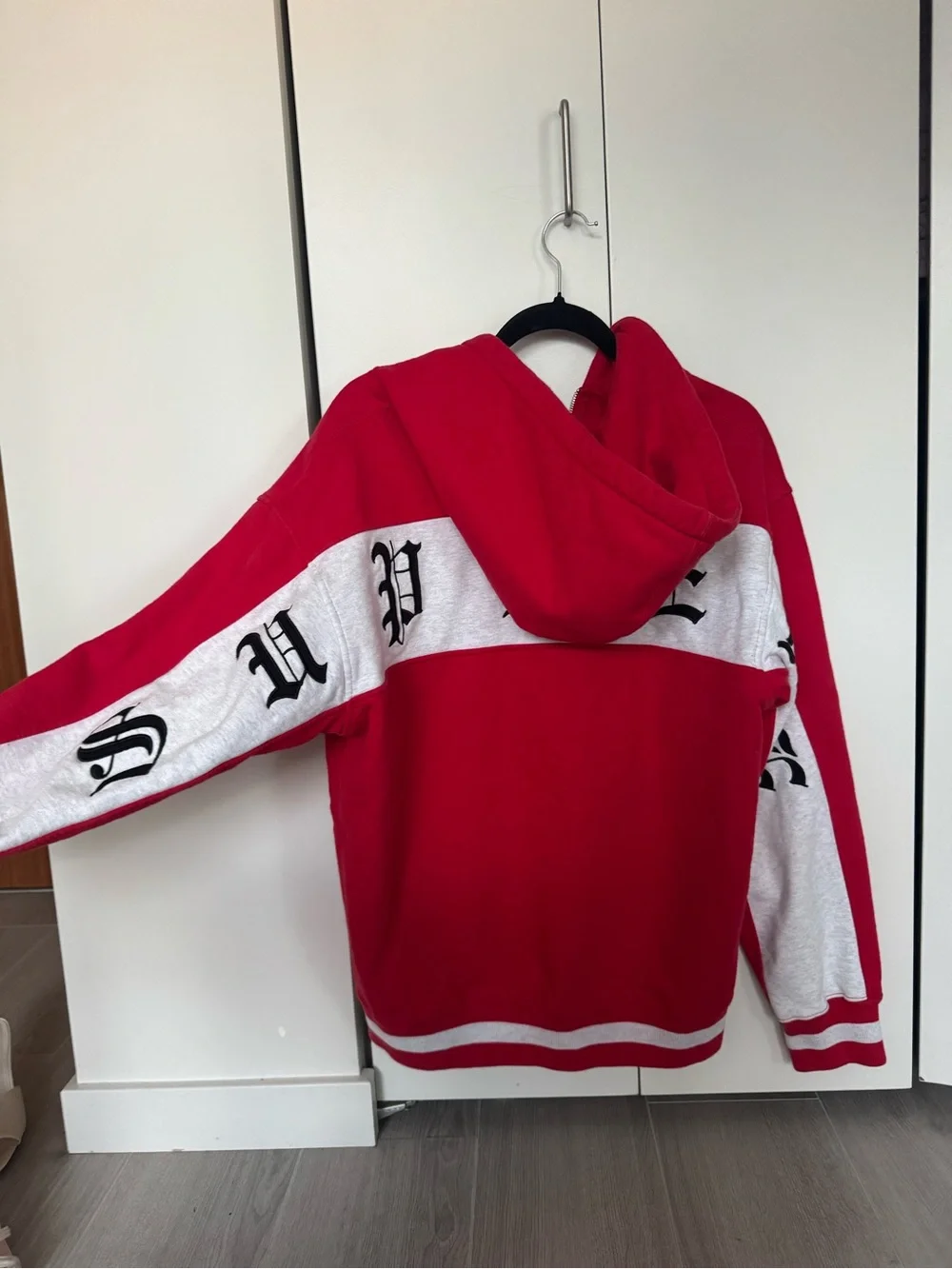 Supreme Red and White Zip-Up Hoodie with Gothic Script